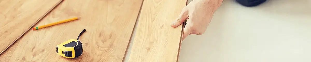 A professional installing wood flooring in Clearwater, FL