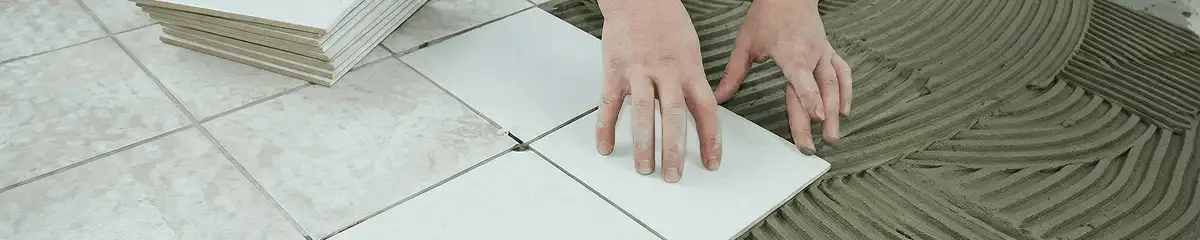 Professional installing white tile floors in Clearwater, FL