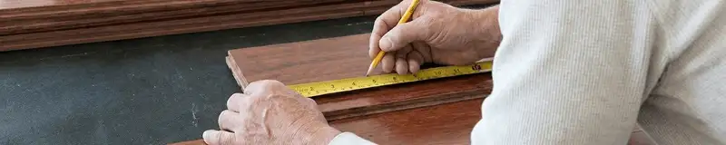 A professional installing wood flooring in Clearwater, FL